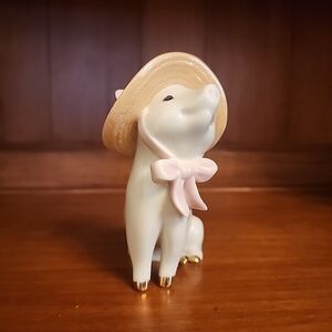 Charming White Porcelain Pet Figurine with Hat
